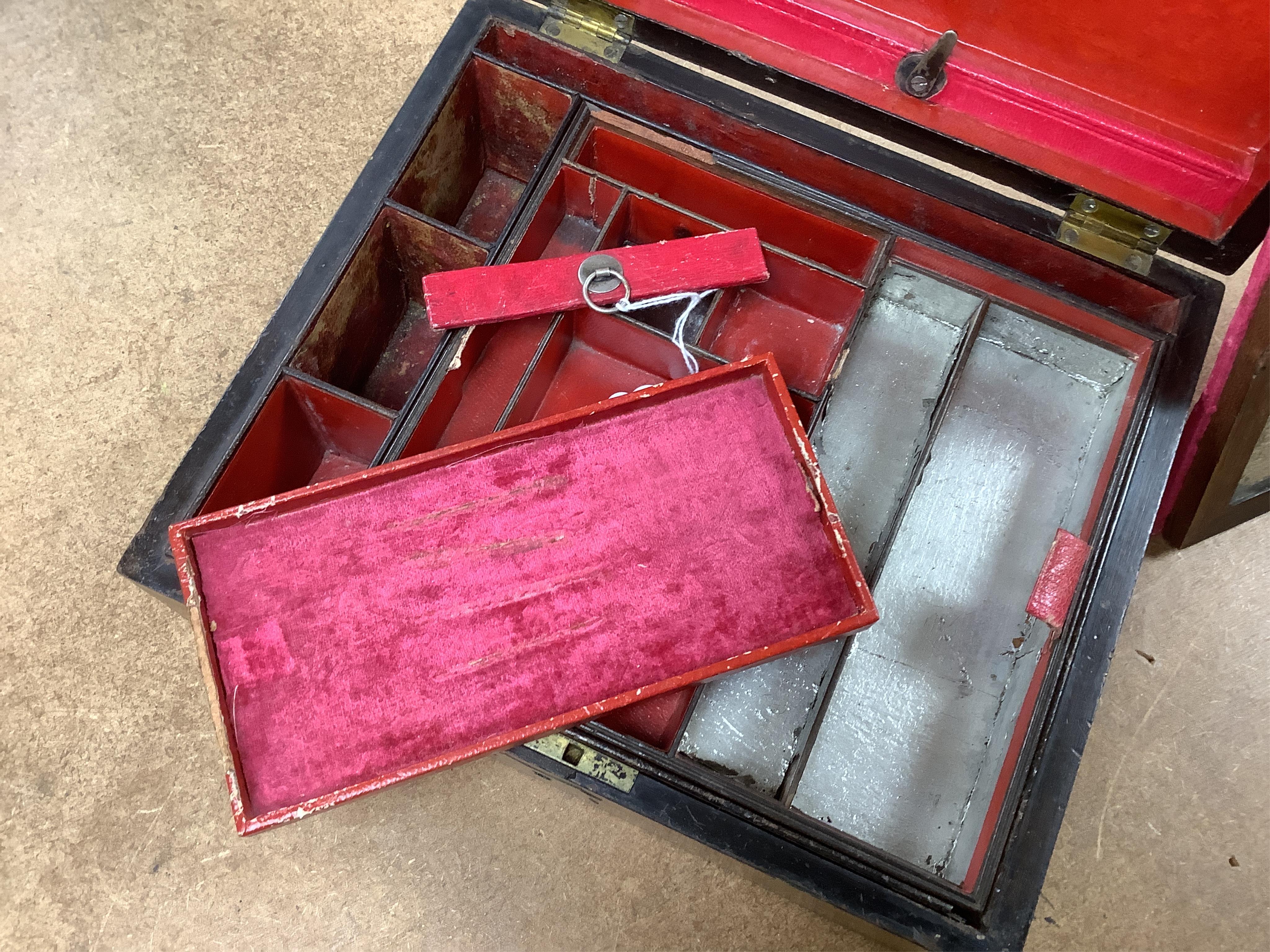 A George IV mahogany and brass bound campaign vanity box with original fittings, 27cm wide x 23cm deep x 10cm high